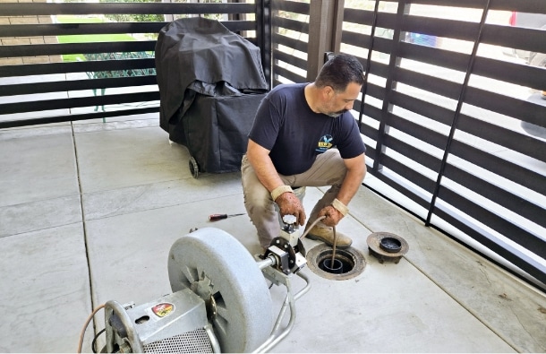 Bow Tie Performing Drain Cleaning