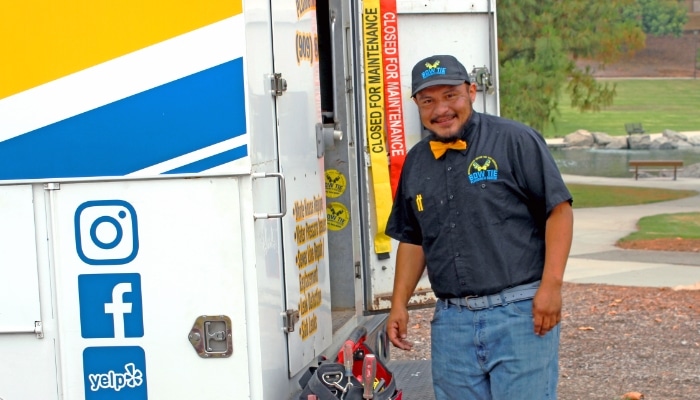 Bow Tie Plumber With Tool Bag And Truck