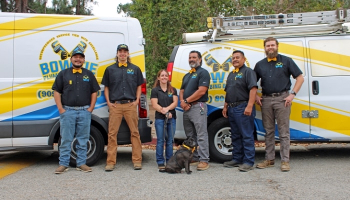 Two plumbers after tankless water heater install