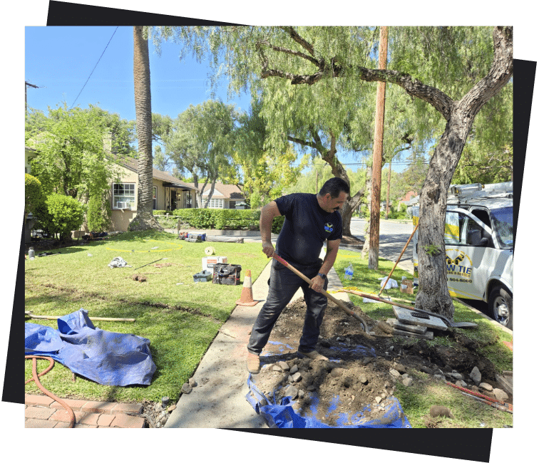 bow-tie-working-on-plumbing-exterior